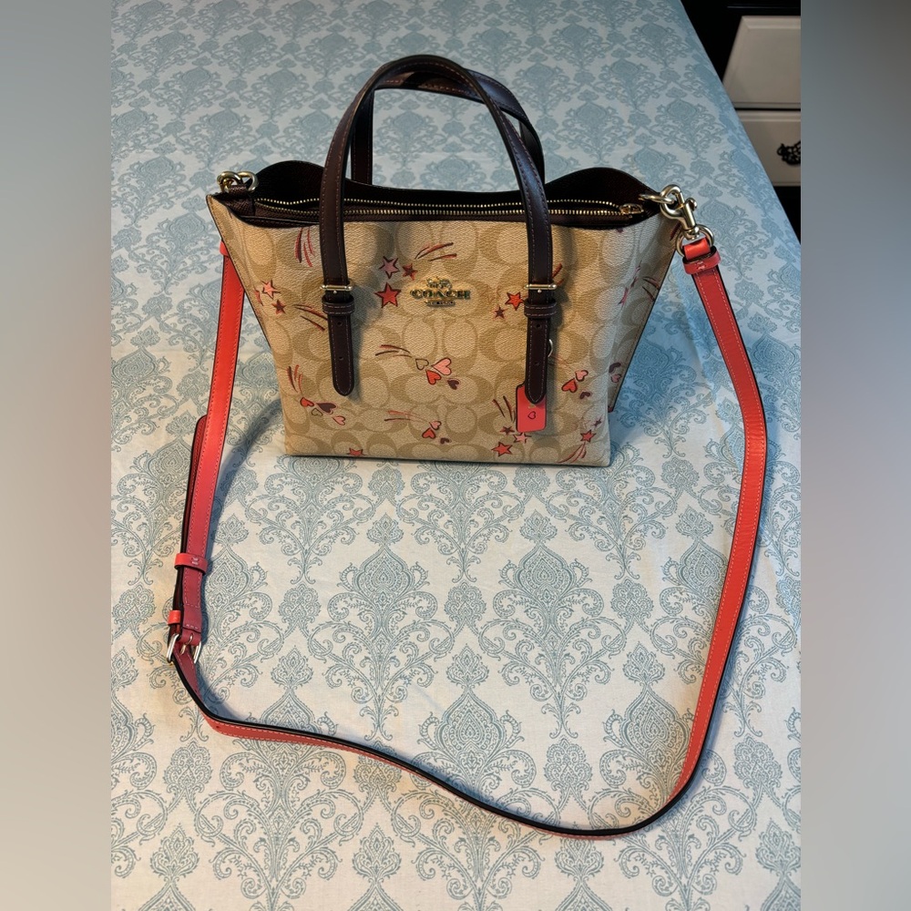 Coach Mollie Tote 25 in signature canvas with heart and start print.
